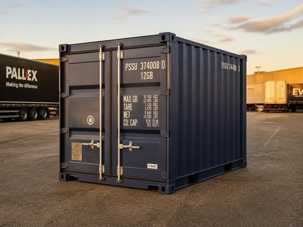 A single 10ft navy shipping container at a UK haulage depot