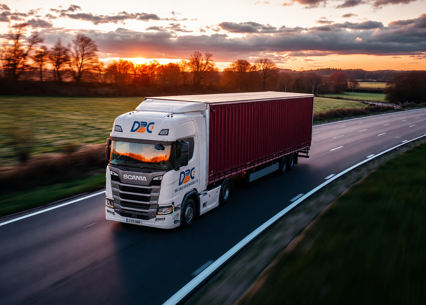 DBC Logistics Scania HGV with container trailer on a UK motorway at sunset